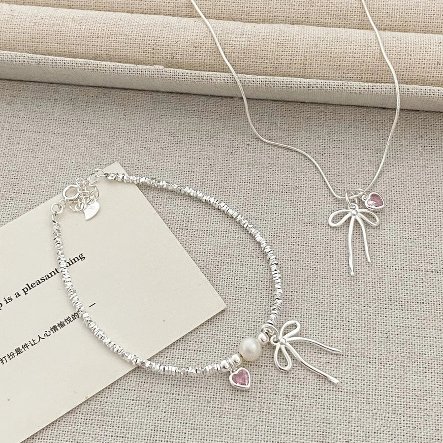 نیمست گردنبند و دستبند پاپیون و قلب