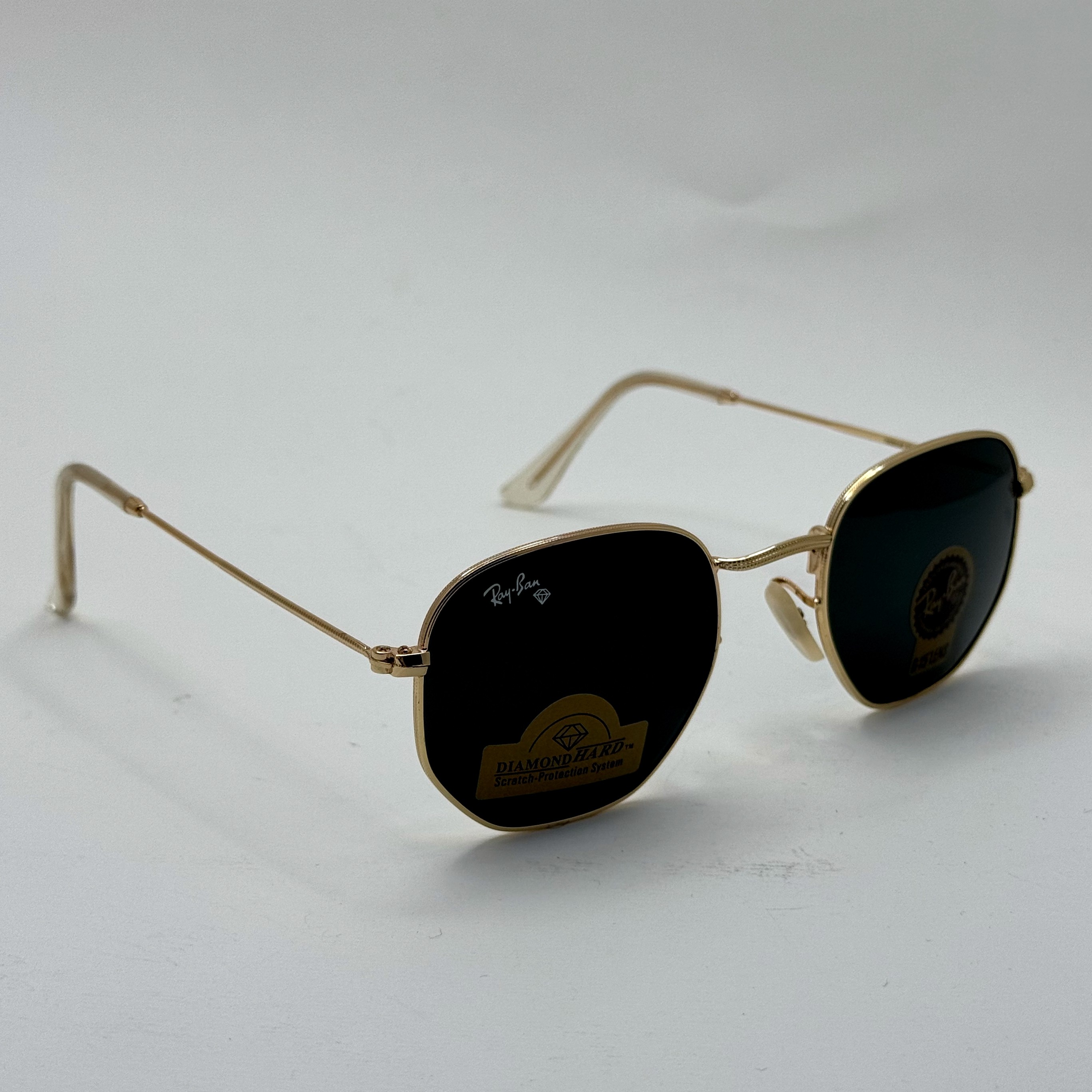 عینک ریبن هگزونال شیشه سنگ مشکی فریم طلایی به همراه پک کامل ریبن کد Rayban RB 3548 (ارسال رایگان)